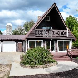 Three bedroom Chalet home on 40 acres and pole Barn and 2 Artesian wells