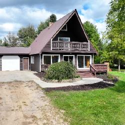 Three bedroom Chalet home on 40 acres and pole Barn and 2 Artesian wells