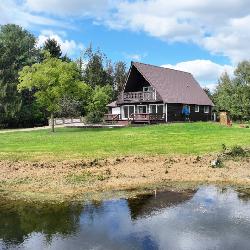 Three bedroom Chalet home on 40 acres and pole Barn and 2 Artesian wells