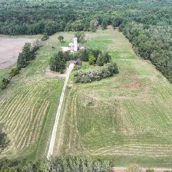 Three bedroom Chalet home on 40 acres and pole Barn and 2 Artesian wells