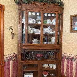 Antique Oak Bowed-Glass China Cabinet with Carved Detail