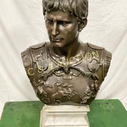 Bronze Bust Depicting a Roman Figure on White Marb